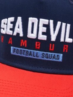 Hamburg Sea Devils Trucker Cap 2024 Design 2 11 Hamburg Sea Devils Trucker Cap 2024 Design 2 -Football Gear Shop 105 KH 289 4063237042201
