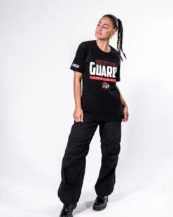 Helvetic Guards Identity T-Shirt -Football Gear Shop Merchandise 2023 BalkenFootball Black Eleni FullBody HVG Logogross T Shirt Women